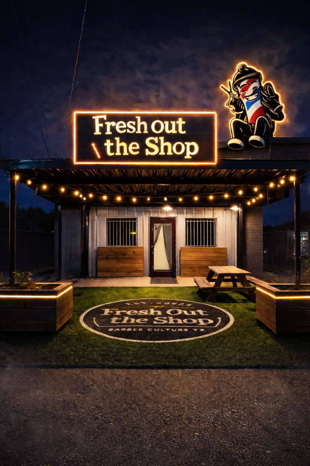 Fresh Out The Shop storefront at night, neon sign glowing